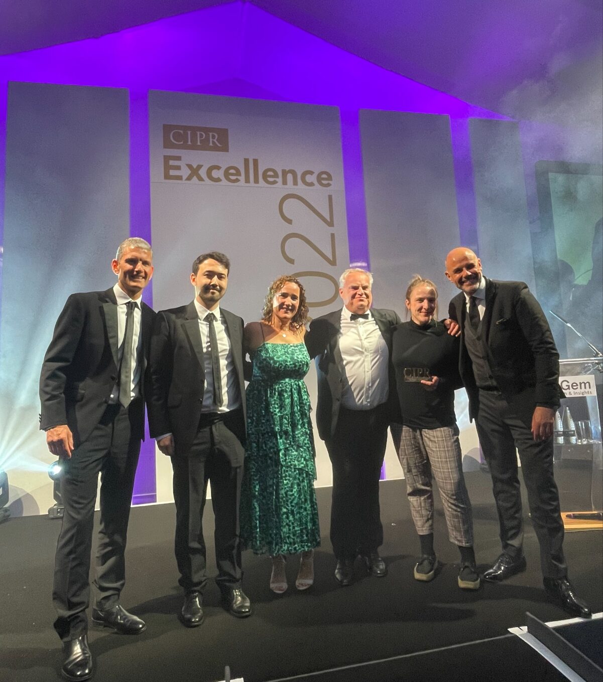 The IPC and FleishmanHillard team celebrate on stage at the CIPR Excellence Awards