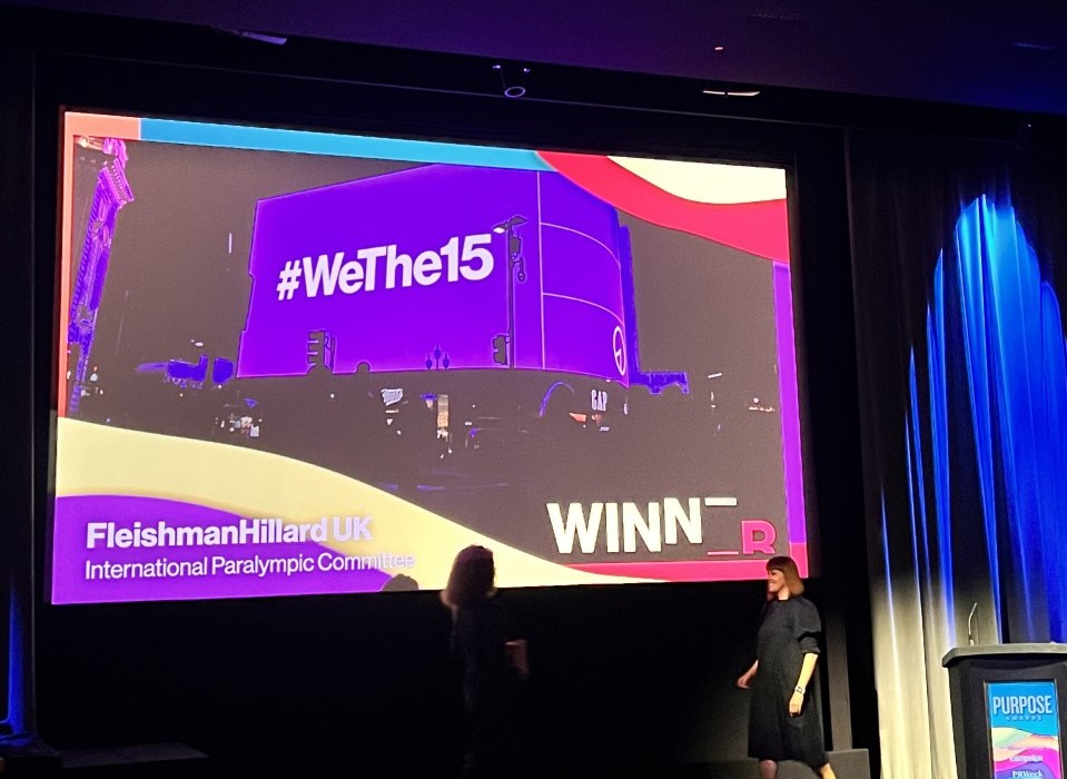 The stage at the EMEA Purpose Awards with #WeThe15, International Paralympic Committee and FleishmanHillard UK written on the big screen